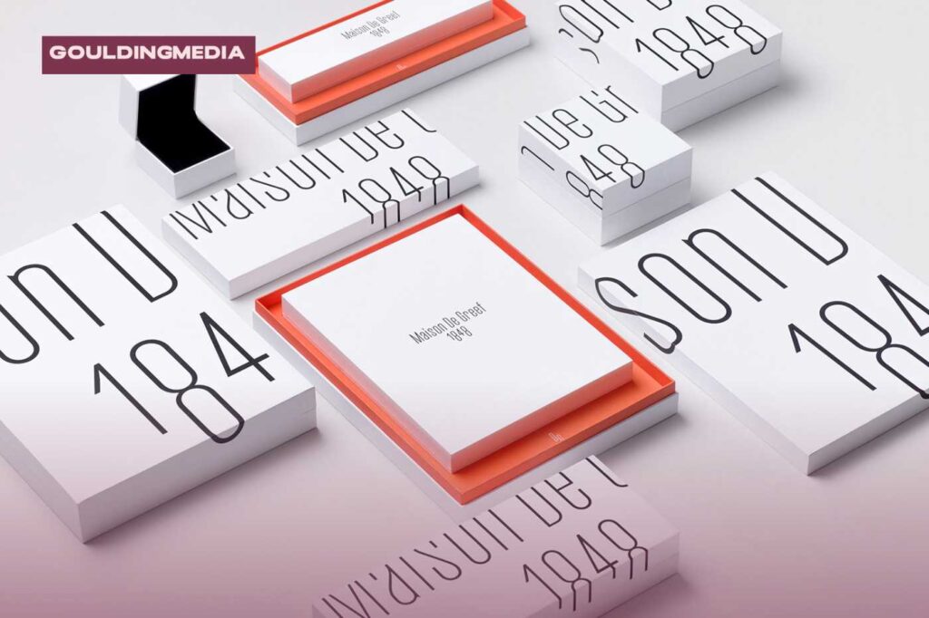 Minimalist jewellery packaging design for Maison De Greef 1848, with white boxes, fine typography, and coral interior accents.