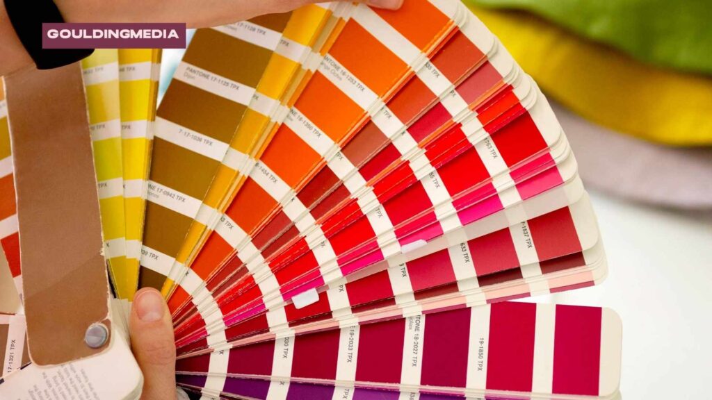 A Pantone colour swatch book being used to match precise shades for packaging print consistency