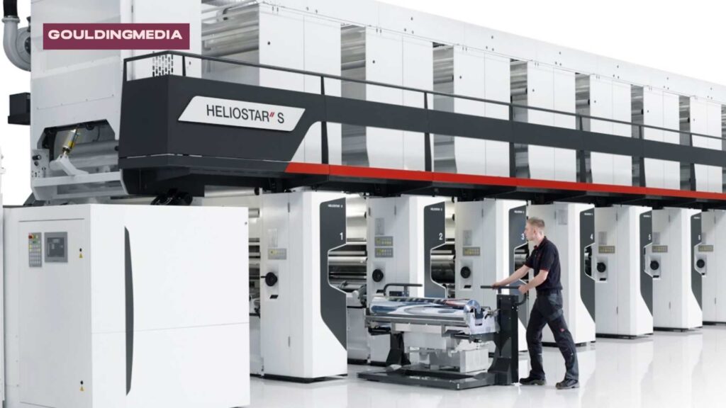 Technician operating gravure printing press in a high-volume packaging production facility