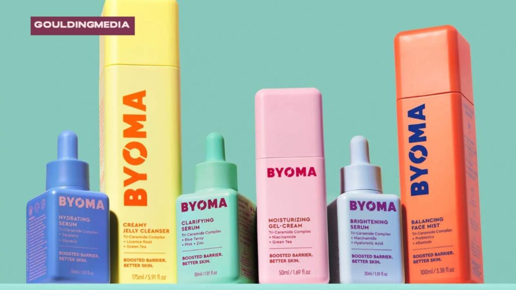 Brightly coloured BYOMA skincare products lined up against a turquoise background.