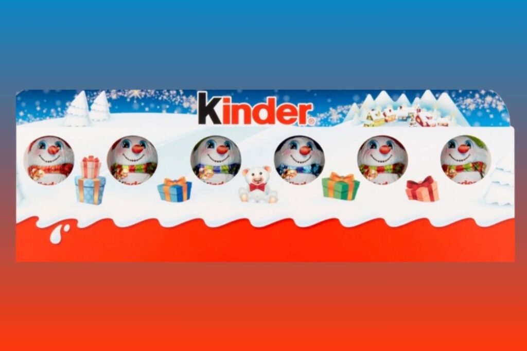 Kinder mini chocolates in a wintry-themed box with snowy backdrop.