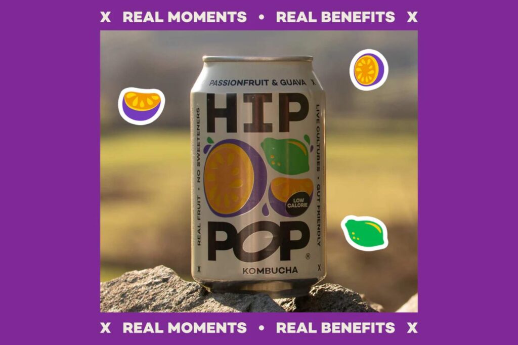 Hip Pop sparkling probiotic drink with floating fruit illustrations and the tagline “Real Moments, Real Benefits”.