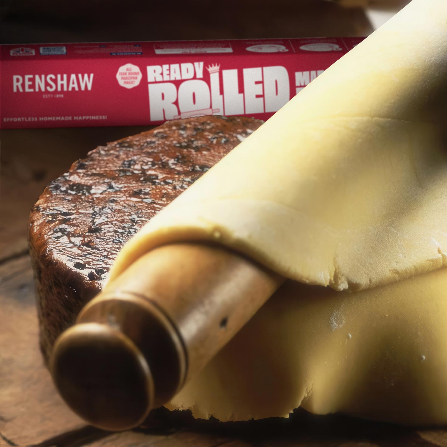 Renshaw Ready to Roll Marzipan pack in redesigned purple and white packaging, showing the marzipan block through a clear front window.