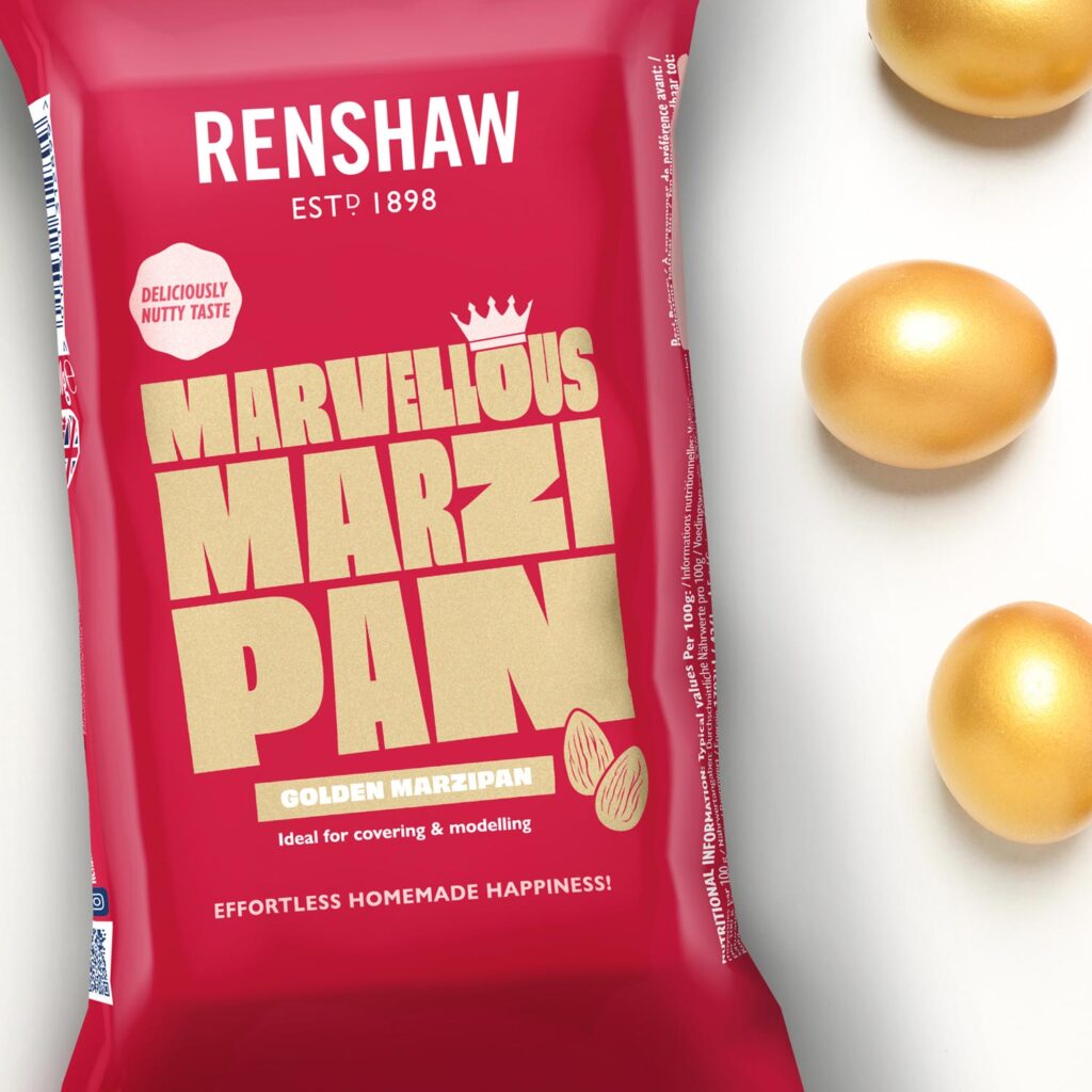 Multiple packs of Renshaw Ready to Roll Marzipan in red packaging arranged in a layered display on a light baking surface
