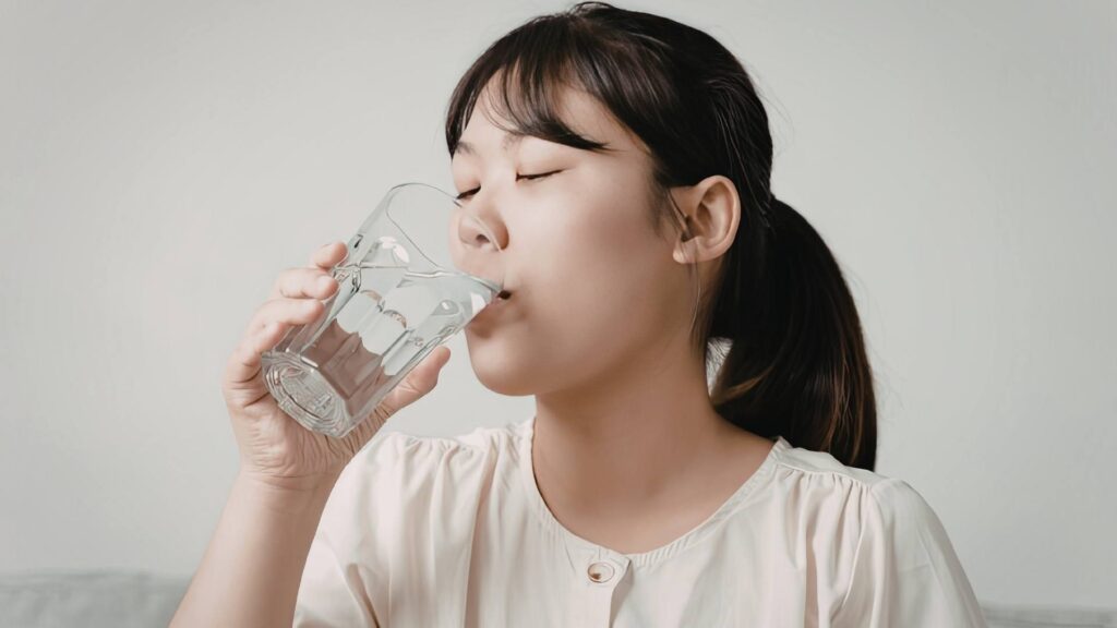 Woman drinking a glass of water