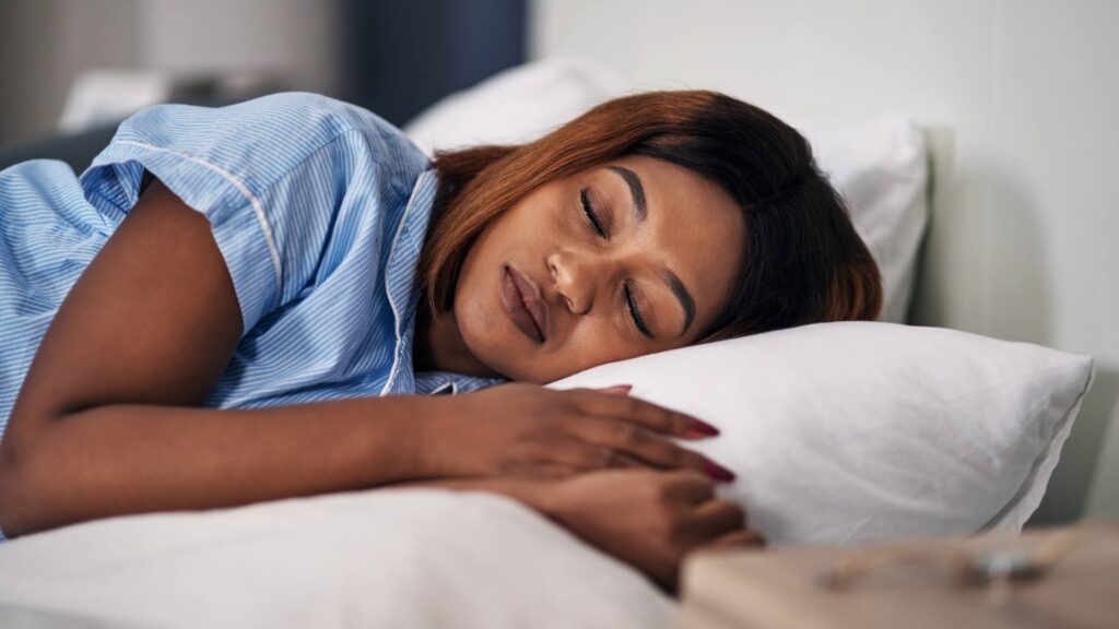 Woman sleeping peacefully in bed