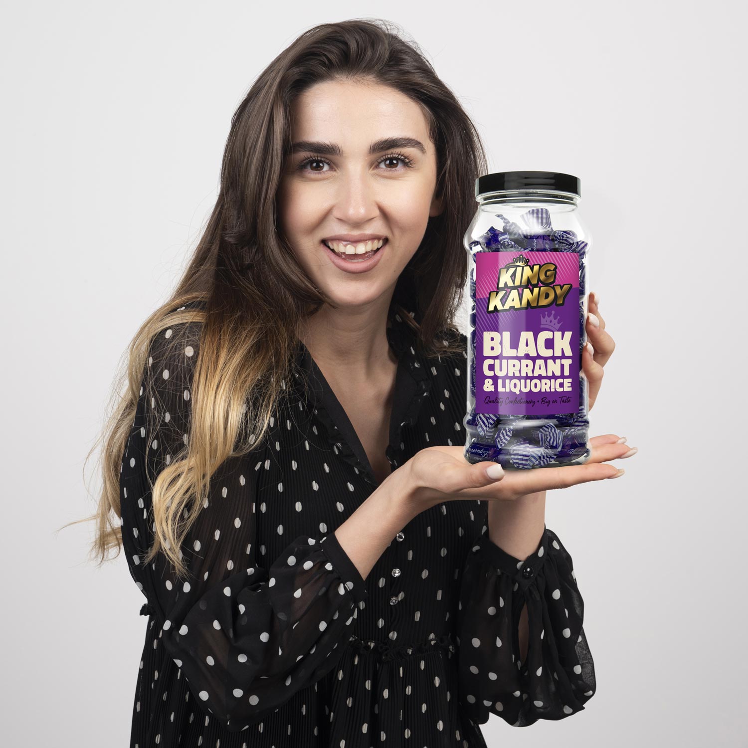 Young Woman holding Packaging Design Confectionery Jar from King Kandy