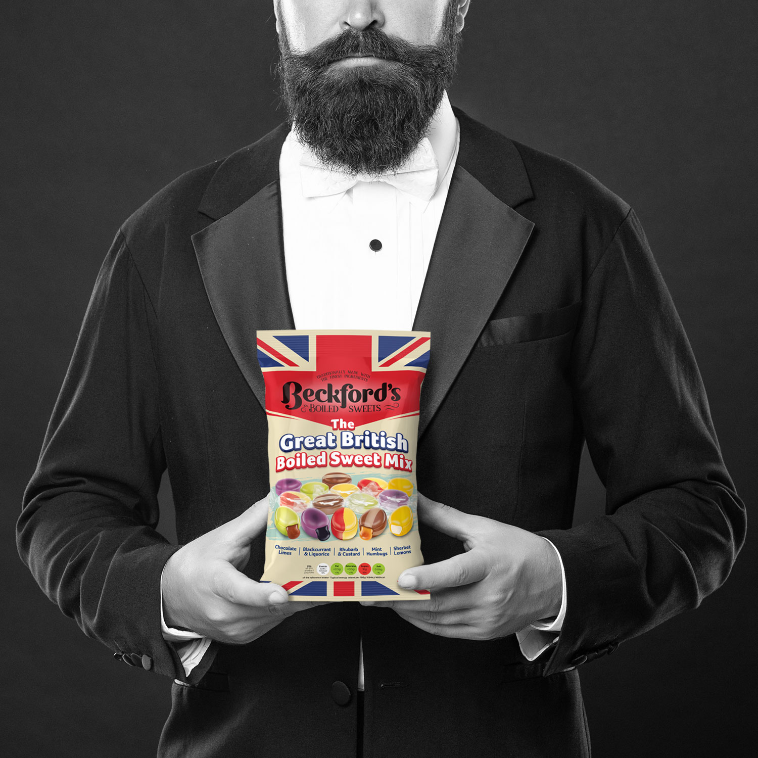 A British bearded Gentleman holding British-themed packaging 2025