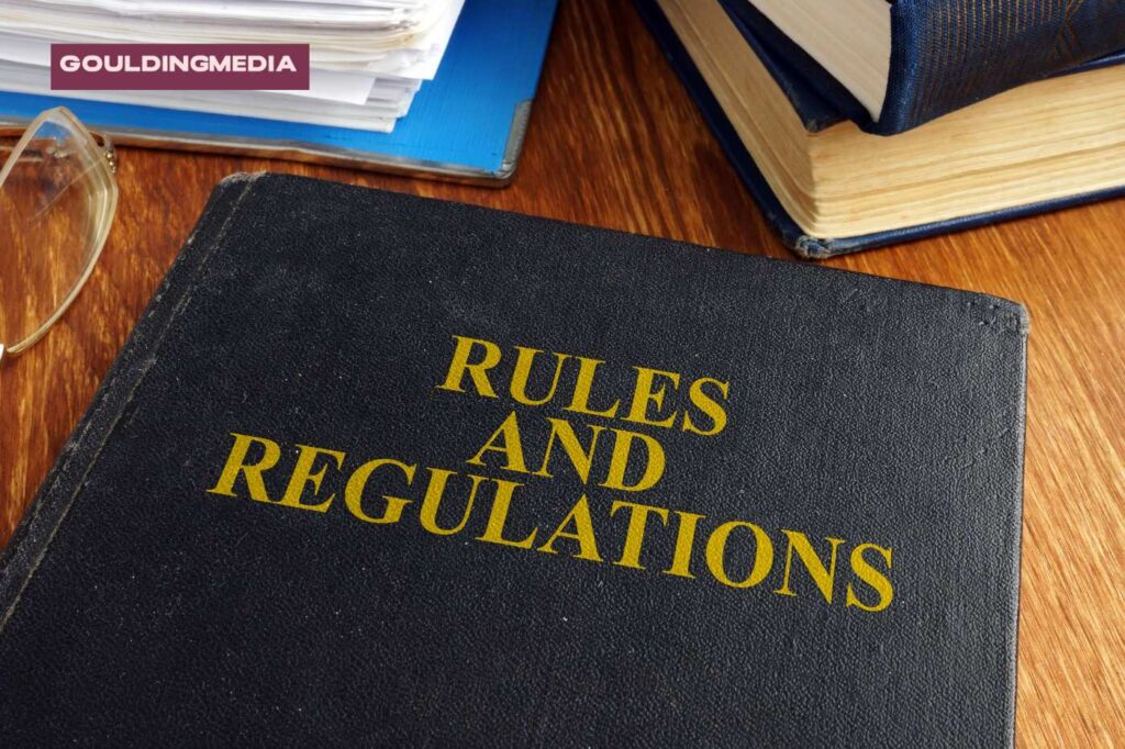 A book titled Rules and Regulations on a desk