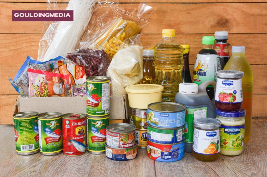 A variety of canned and packaged food items on a table